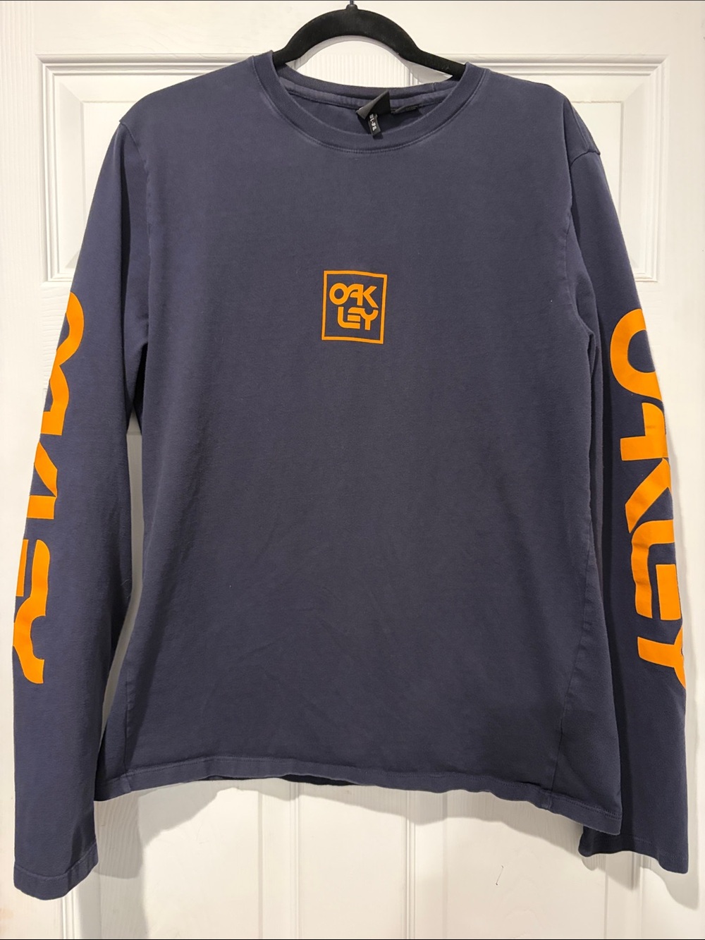 Oakley Navy Long Sleeve Tee with Orange Sleeve Logos